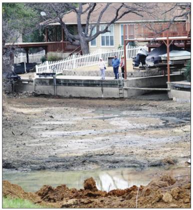 On Lake LBJ, a drawdown of the waterway exposed several coves allowing shoreline residents to dredge and conduct structure maintenance and repairs. File photo