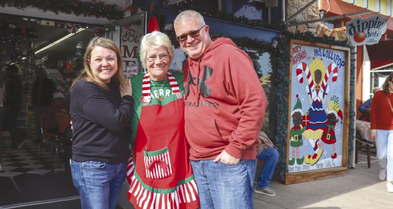 Smiles and hugs were shared between old friends Dec. 2 during the Marble Falls Christmas Market on Main. Pictured, from left, are Christy Boern, Terrie Vanscoy and Cory Boern, who got together for a candid photo in front of Ms Lollipop Parties Fun &amp; Gifts, 208 Main St.