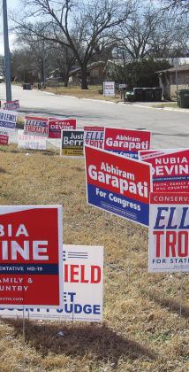 Candidate campaign signs in Burnet filled narrow ground near the AgriLife Auditorium parking lot through last Thursday during the first week of early voting. By law, all election signs for all candidates must be placed more than 100 feet away from the center’s front door. Photo by Raymond V. Whelan